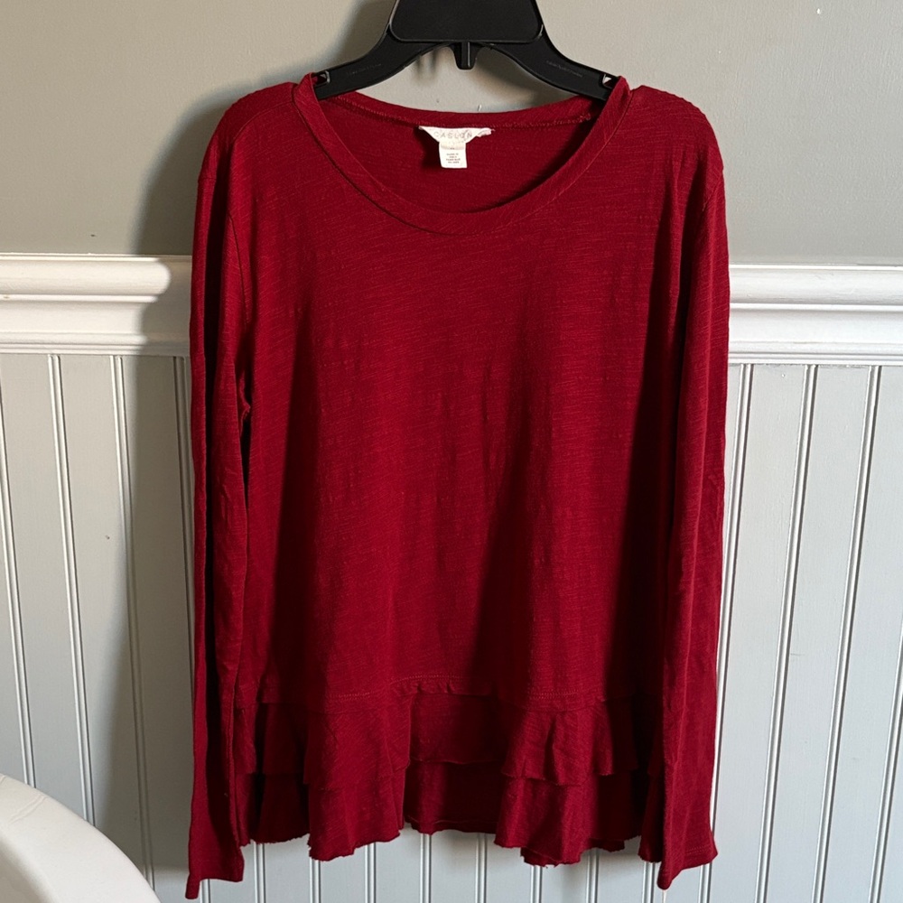 Dark red long sleeve top.